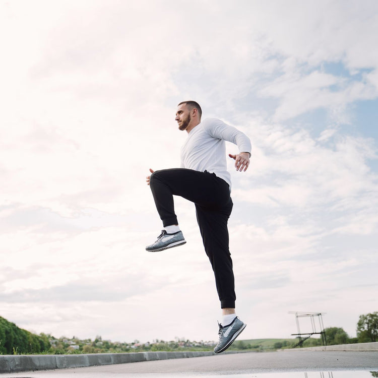 Active man mid-stride outdoors, representing Men's Health